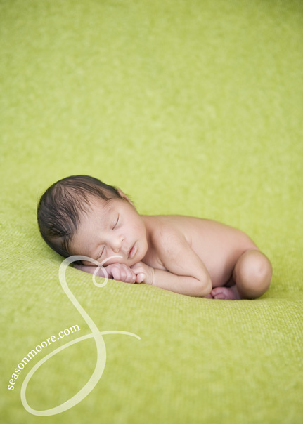 Preemie Newborn on Green Blanket