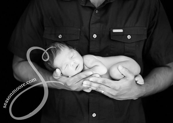 Preemie in Daddy's hands Newborn