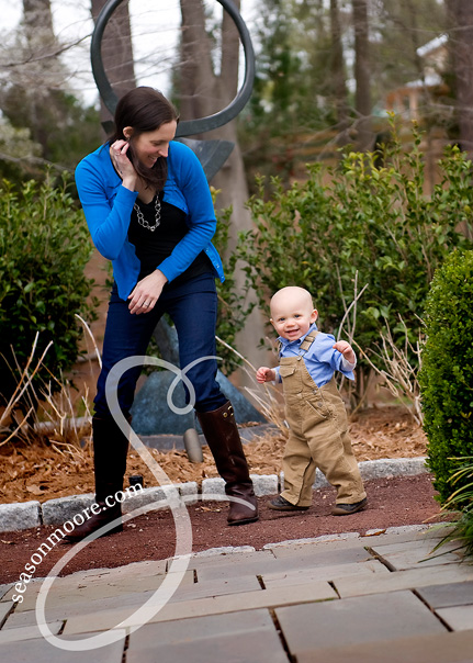 1 year old boy running with mother