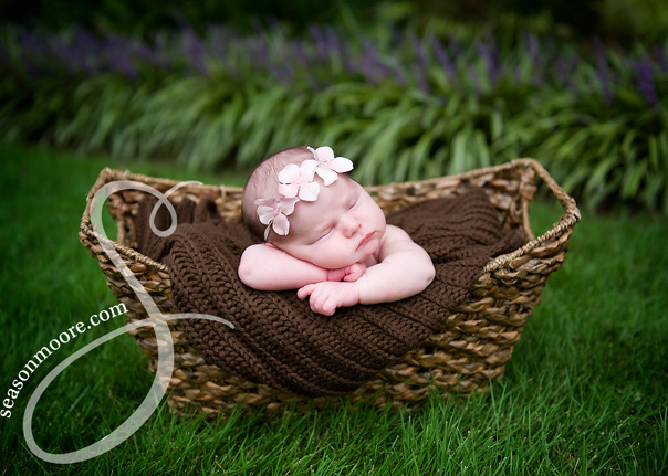 newborn girl outside basket