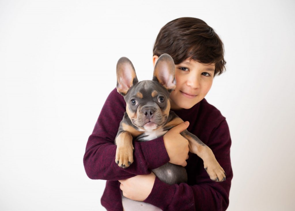 boy and puppy in studio